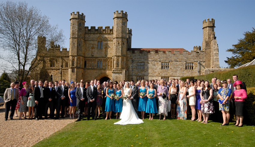 Wedding party group photograph outside Battle Abbey