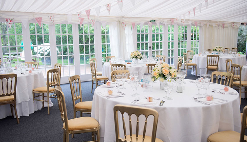 Inside the marquee at Broyle Place, an East Sussex wedding venue