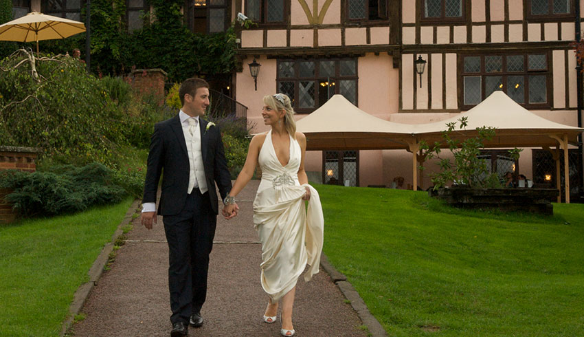 Bride and Groom outside Mannings Heath Golf Club, a West Sussex wedding venue