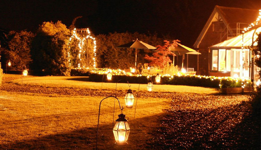 The gardens at night at the Parrot Inn, a Surrey Wedding Venue