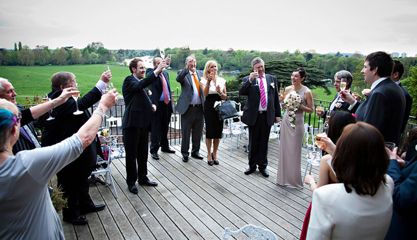 Wedding celebration on the terrace at the Petersham Hotel, a Surrey wedding venue